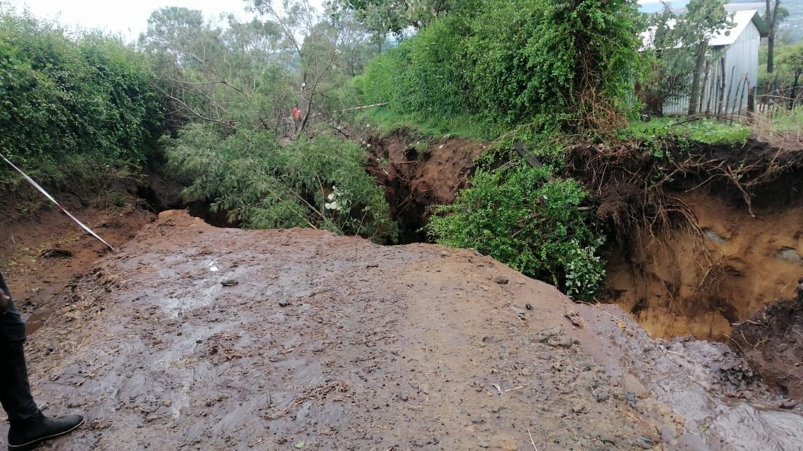 Heavy downpour sweeps away road in Kihika's backyard