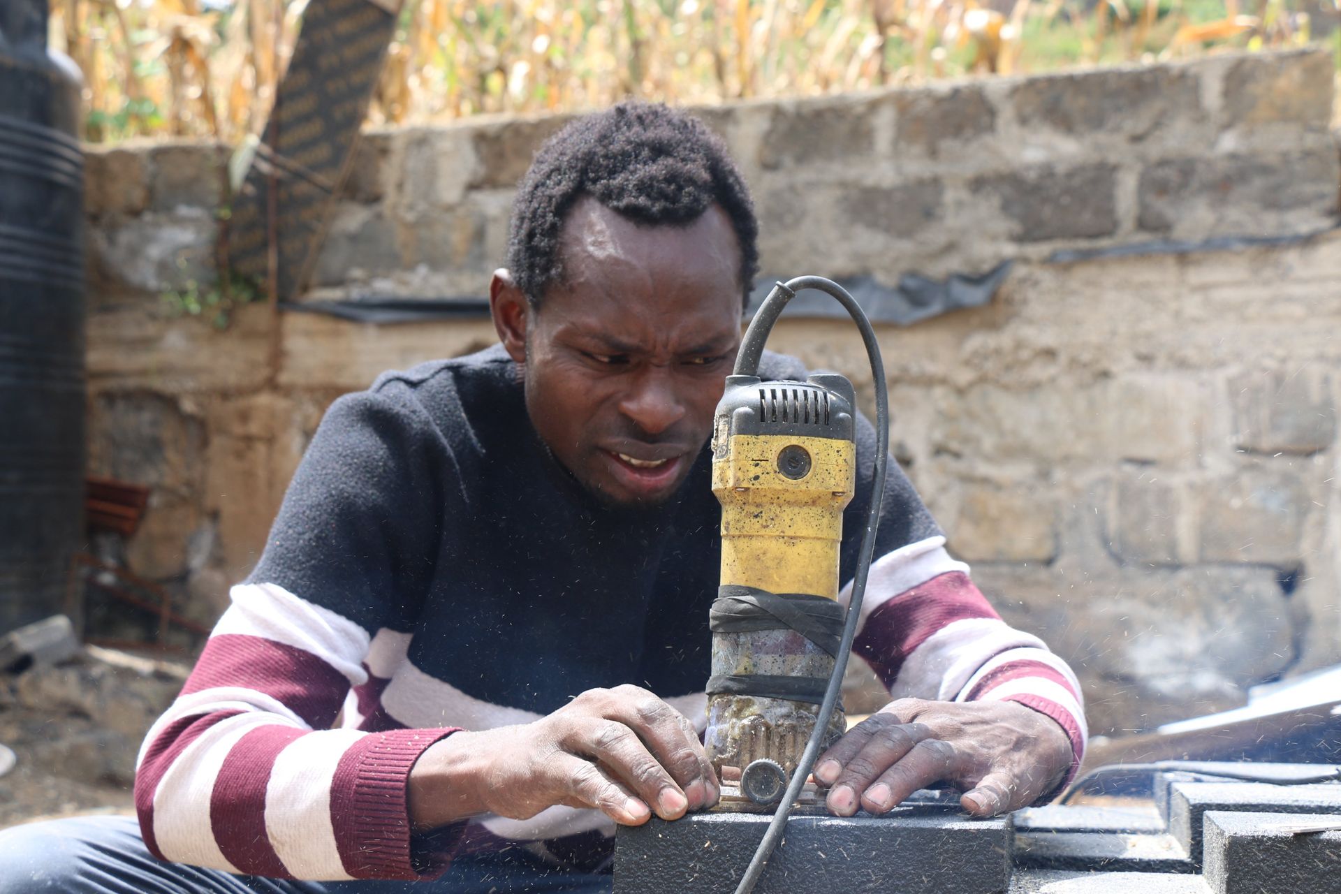 Peter Kinyua: Man using recycled glass to make building material