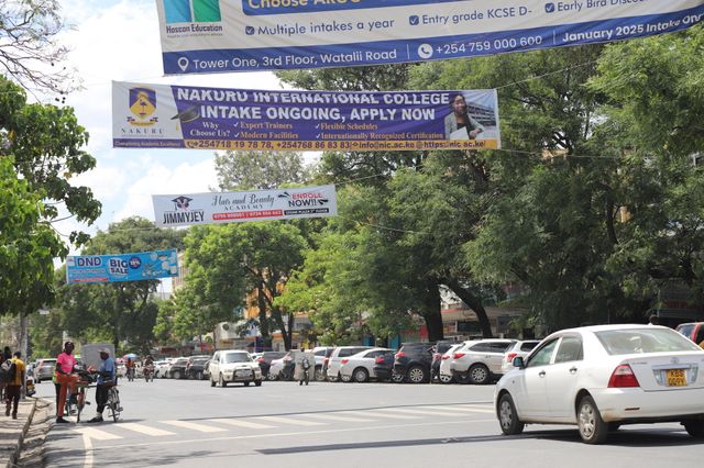 Welcome to Nakuru City, where trees have unwillingly become prime advertising real estate